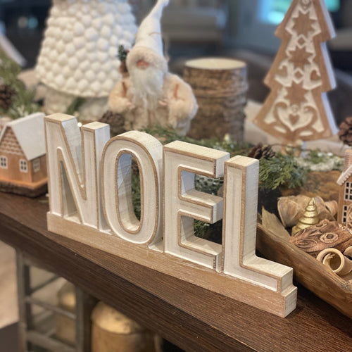 Carved NOEL on Base